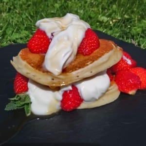 Strawberry pancakes with Greek yogurt, maple syrup