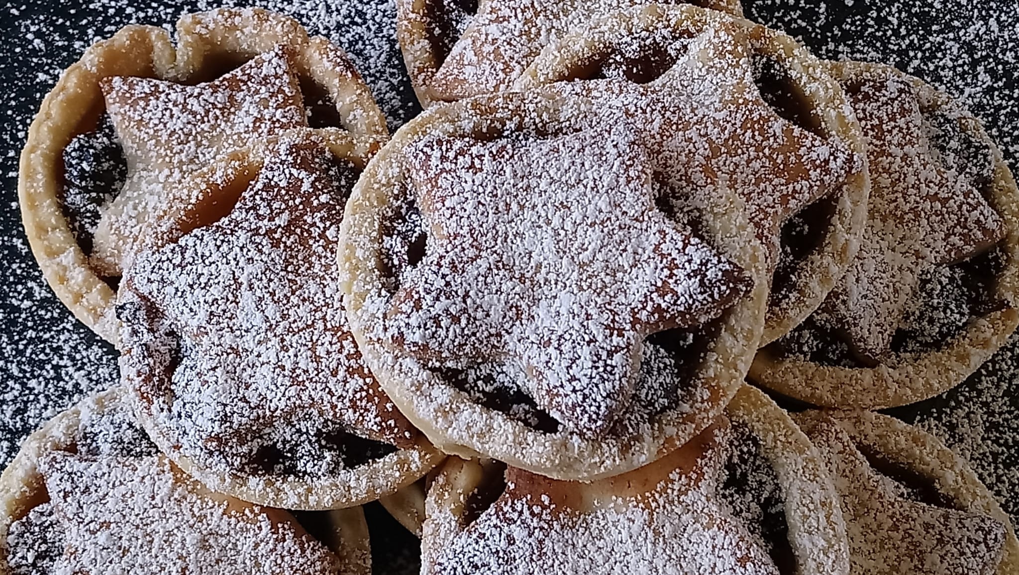 Homemade mince pies dusted with icing sugar