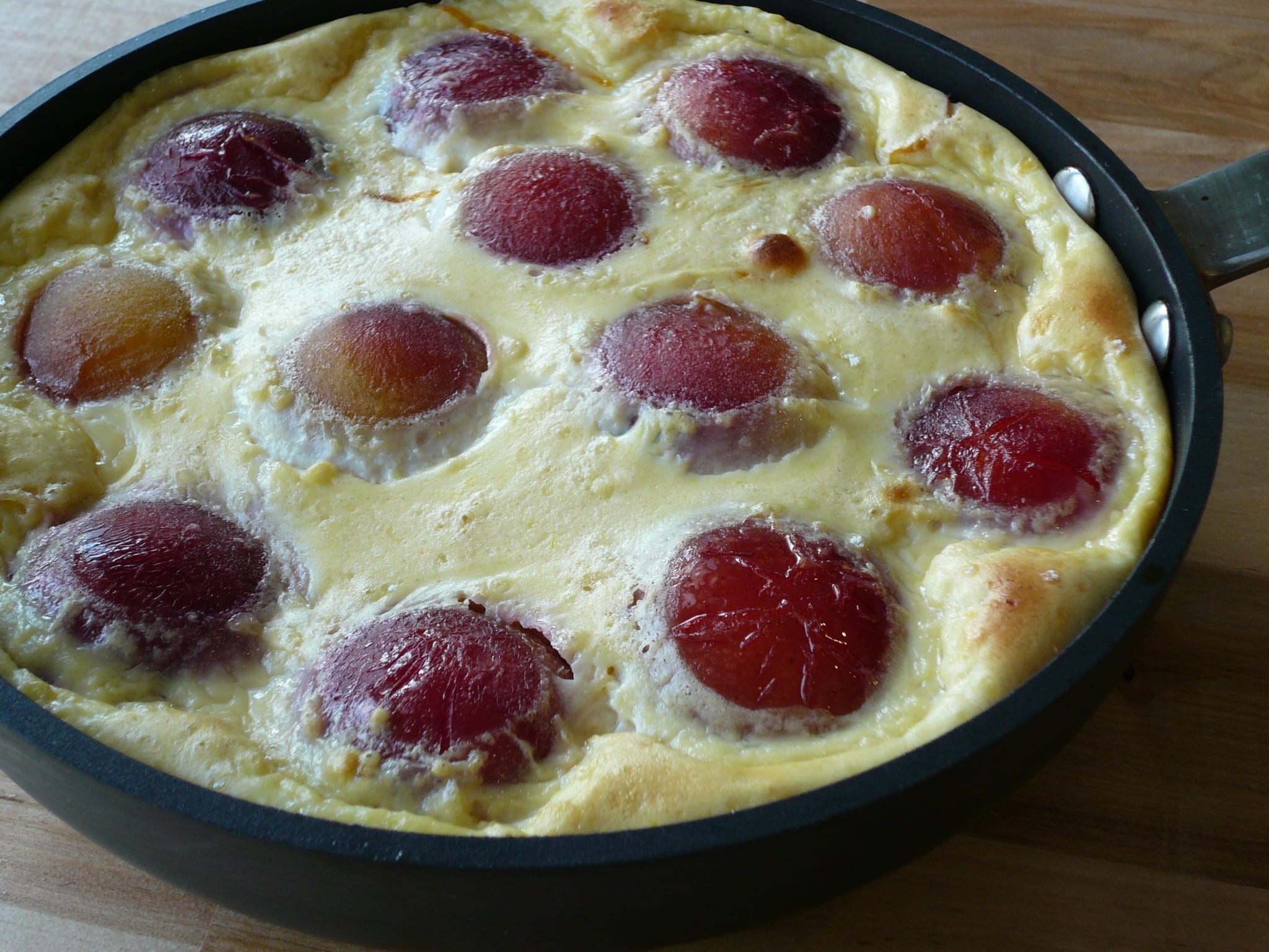 Baked roasted plum clafoutis out of the oven