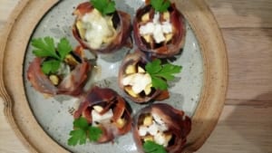 A plate of figs wrapped in Parma ham and roasted with Gorgonzola