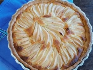 Pear slices arranged over an almond tart