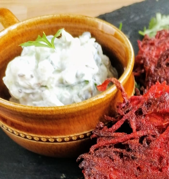 A pot of cucumber and yogurt mixed with spices