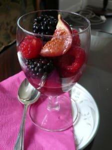 A glass of fresh figs, raspberries & blackberries marinated with honey