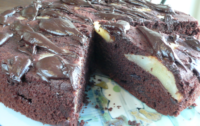 Chocolate cake baked with pear halves
