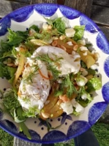 A warm salad with poached eggs, fennel, pinenuts & feta cheese
