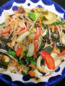 A bowl of soba noodles and vegetables