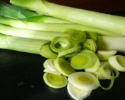 A pile of sliced and whole leeks