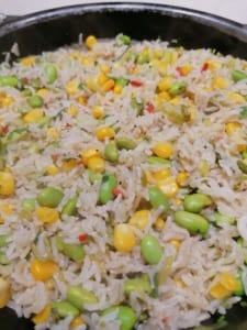 A dish of seamed rice, vegetables and herbs