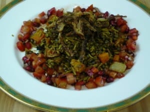 A dish of green lentils, rice, crispy onions, surrounded by tomato relish