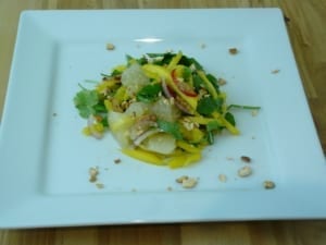 Pomelo salad with herbs and mango strips