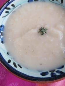 An image of a bowl of celeriac, apple & thyme soup
