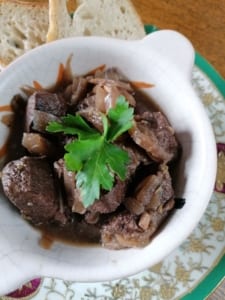 An image of a dish of beef, red wine & onion casserole