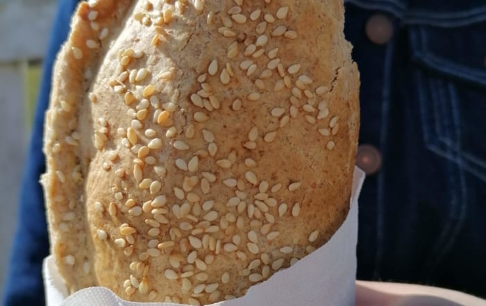 An image of a pasty being eaten on a picnic