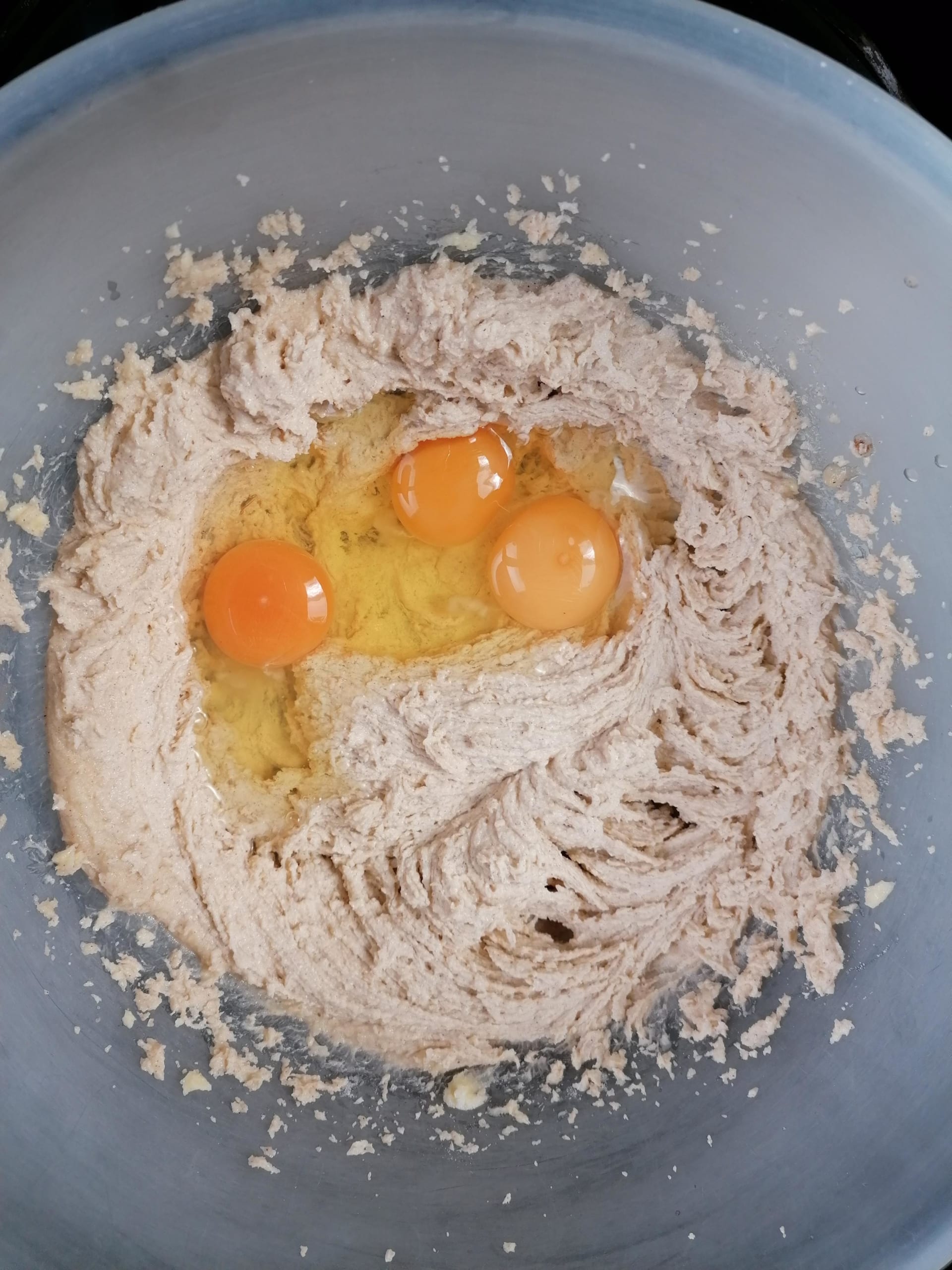 an image of cake mix with eggs ready to beat in