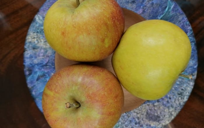 an image of three Cox apples