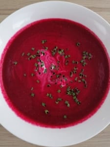 A bowl of beetroot and ginger soup
