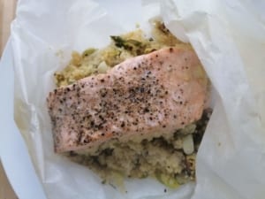 An image of fillet of salmon cooked in a parcel with pistachio & lime couscous
