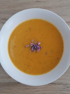 A bowl of Cream of Squash & Carrot Soup