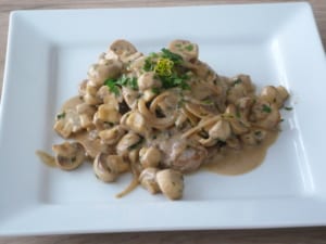 a dish of pork fillet cooked with mushrooms & thyme