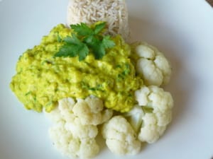 An image of coconut dhal served with cauliflower