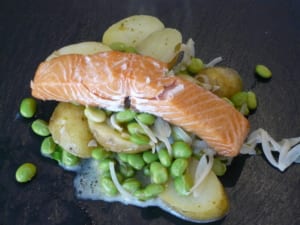 An Image of stoved potatoes with kiln smoked salmon soya beans
