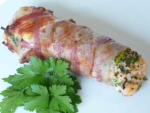 An image of pancetta wrapped salmon with herb stuffing