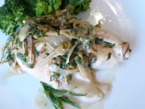 a dish of pan fried chicken with sherry & tarragon sauce
