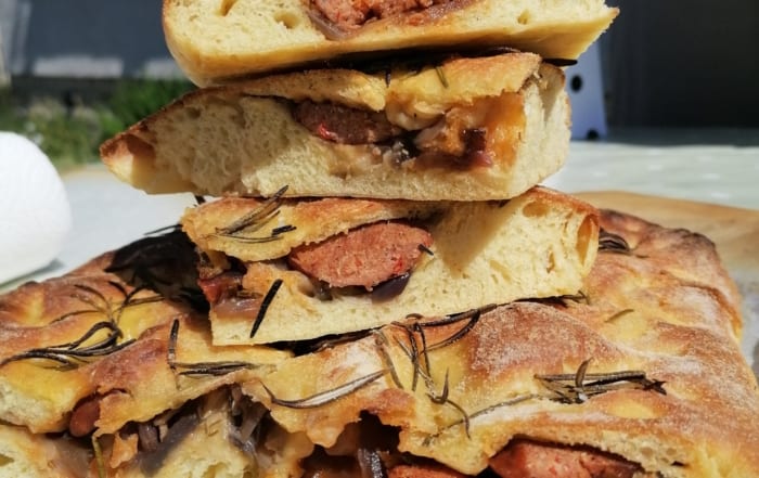 An image of a stack of stuffed focaccia slices
