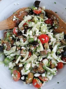 A bowl of roasted aubergine and feta cheese salad