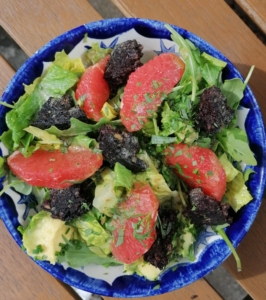 An image of a salad with black pudding and pink grapefruit