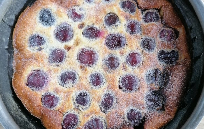 Black cherry clafoutis dusted with caster sugar