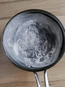A frying pan dusted with flour