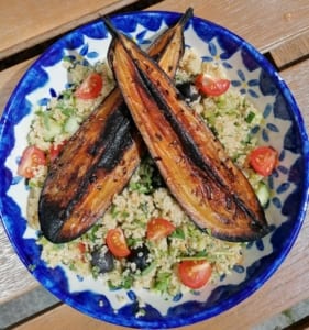 An image of aubergine grilled with ras en hanout spices and served with quinoa salad