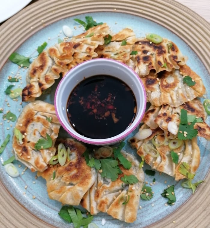 an image of a platter of gyoza dumplings